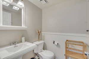 Bathroom featuring sink and toilet