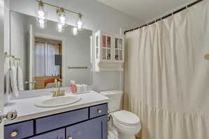 Bathroom with toilet and vanity