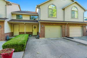 View of front of property featuring a garage