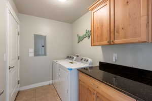 Large Laundry Room with upper and lower cabinets