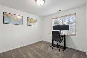 View of carpeted home office