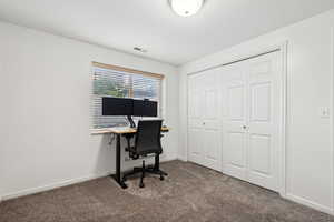 View of carpeted home office