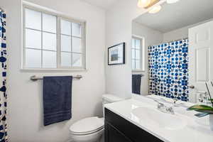 Bathroom featuring toilet and vanity