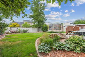 View of yard featuring a trampoline