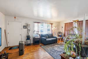 Living room with hardwood / wood-style floors