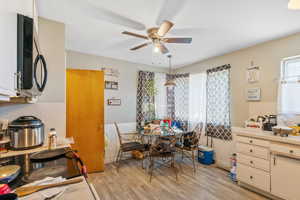 Dining space featuring light hardwood / wood-style flooring and ceiling fan