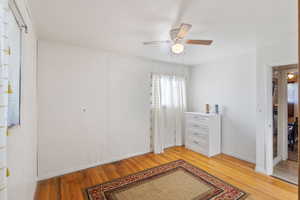 Bedroom featuring ceiling fan and light wood-type flooring