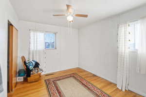 Empty room featuring ceiling fan and light hardwood / wood-style floors