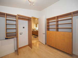 Interior space featuring light hardwood / wood-style flooring and lofted ceiling