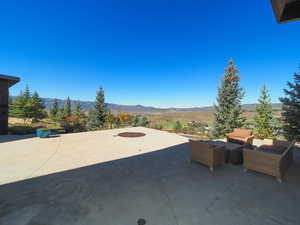 View of patio / terrace featuring an outdoor hangout area and a mountain view