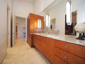 Bathroom with tile patterned floors and vanity