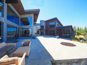 View of patio featuring outdoor lounge area and a balcony