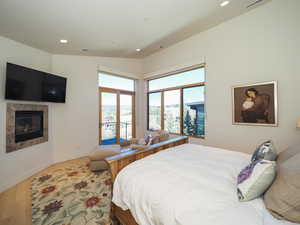 Bedroom featuring vaulted ceiling and hardwood / wood-style floors