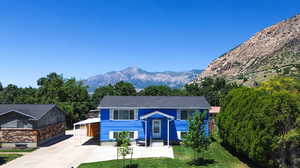 View of front of property with a mountain view