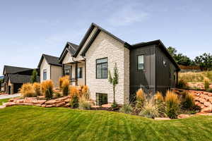 View of front of property featuring a front lawn