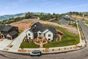 Birds eye view of property with a mountain view