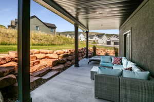 View of covered patio with an outdoor hangout area