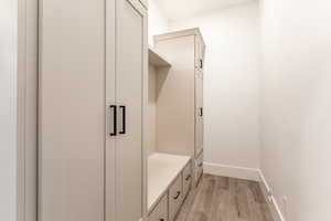 Mudroom featuring light wood-type flooring