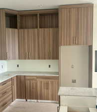 Kitchen featuring light hardwood / wood-style cabinetry