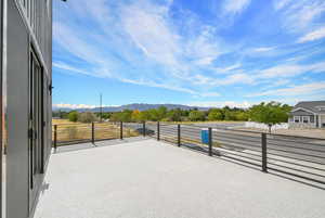 View of patio / terrace featuring a mountain view and a balcony