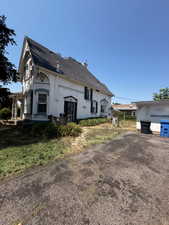 Driveway for upstairs east apartment entrance.