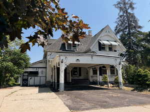 Carport with west entrance as well as separate basement entrance.