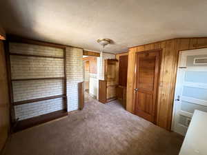 Bedroom off kitchen with basement door access.