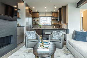 Living room with light hardwood / wood-style flooring