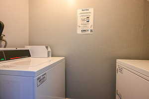 View of laundry. Coin operated Washer and Dryer to the left of the front door.