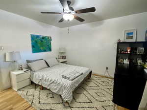 Bedroom featuring ceiling fan and light wood-type flooring