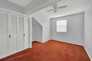 Additional living space with carpet and ceiling fan