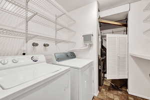 Clothes washing area featuring separate washer and dryer