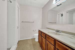 Bathroom with vanity and toilet