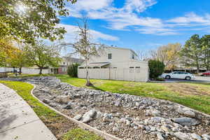 View of side of home with a lawn