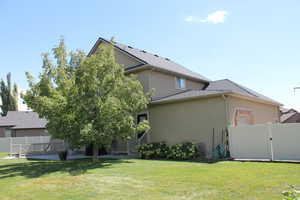 Exterior space featuring a patio and a lawn