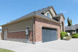 View of property exterior with a garage