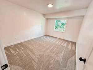 Empty room with carpet flooring