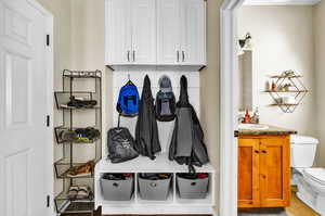 Mudroom featuring sink and tile patterned flooring