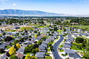 Birds eye view of property with a mountain view