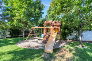 View of jungle gym featuring a yard