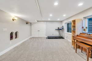 Exercise room with light carpet