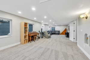 Living room featuring light carpet