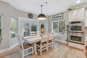 Dining area featuring light hardwood / wood-style flooring and plenty of natural light