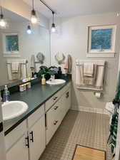 Bathroom with tile patterned flooring, toilet, and vanity