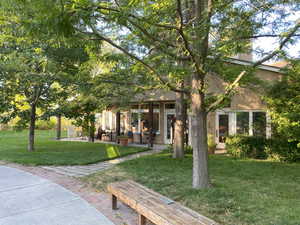 View of property's community with a yard