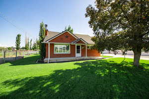 View of front of property featuring a front lawn