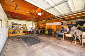 2 car garage area featuring a workshop area and a garage door opener.