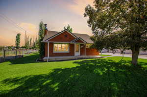 View of front of property featuring a yard