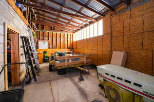 3rd car garage area with tractor and trailer, trimmer, and much more all included.