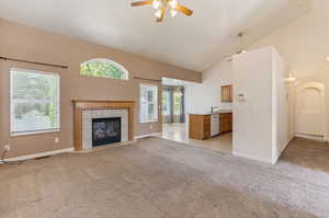 Great Room Leading to Kitchen and Breakfast Nook. Hallway to Primary Bedroom